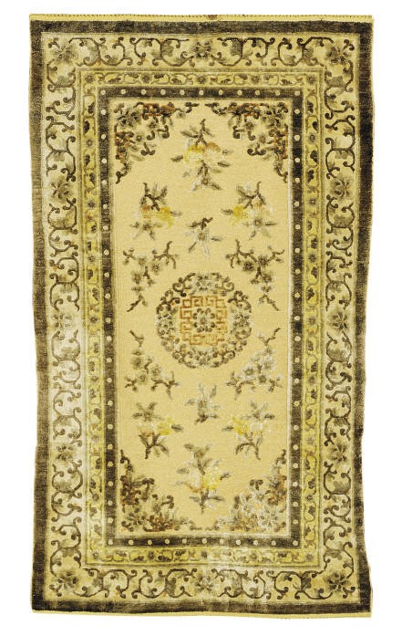 A CHINESE SILK AND METALLIC THREAD RUG