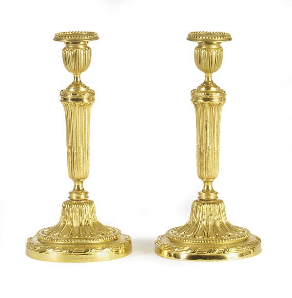 A PAIR OF FRENCH ORMOLU CANDLESTICKS,