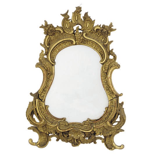 A GILTWOOD AND GILT-COMPOSITION MIRROR,