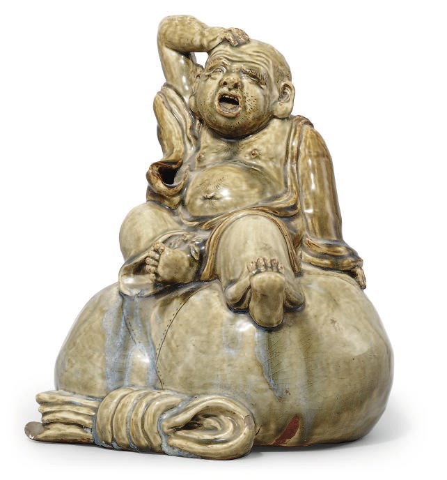 A JAPANESE GREEN CRACKLE GLAZED MODEL OF HOTEI