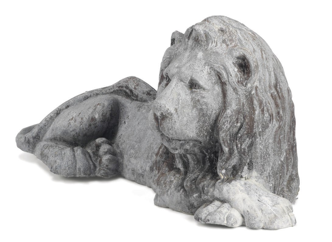 AN ENGLISH LEAD FIGURE OF A RECLINING LION
