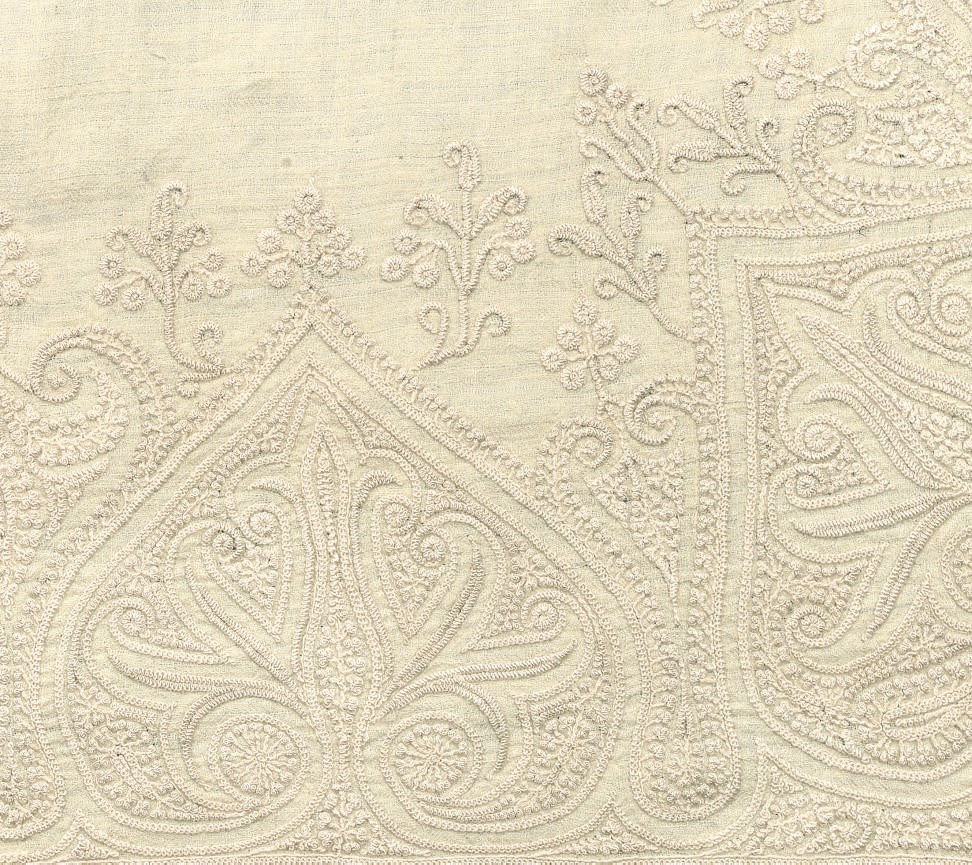 A FINE CREAM FOLDOVER PASHMINA SHAWL