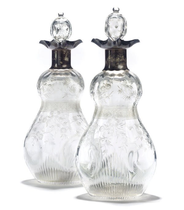 A PAIR OF VICTORIAN WHEEL-ENGRAVED AND SILVER-MOUNTED DECANTERS AND STOPPERS