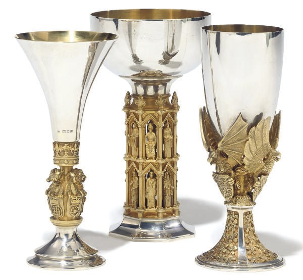 A GROUP OF THREE MODERN PARCEL-GILT SILVER COMMEMORATIVE GOBLETS