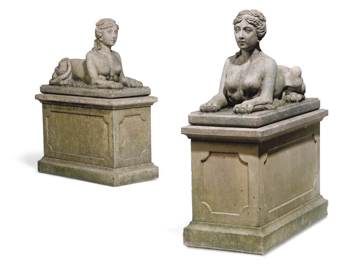 A PAIR OF COMPOSITION GARDEN SPHINXES