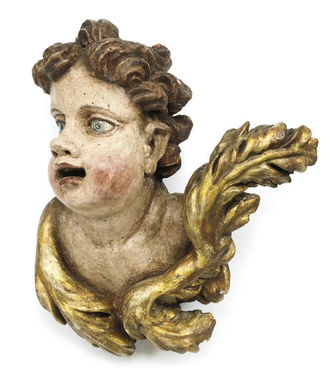 A SOUTH GERMAN GILTWOOD AND POLYCHROME CHERUB HEAD MASK