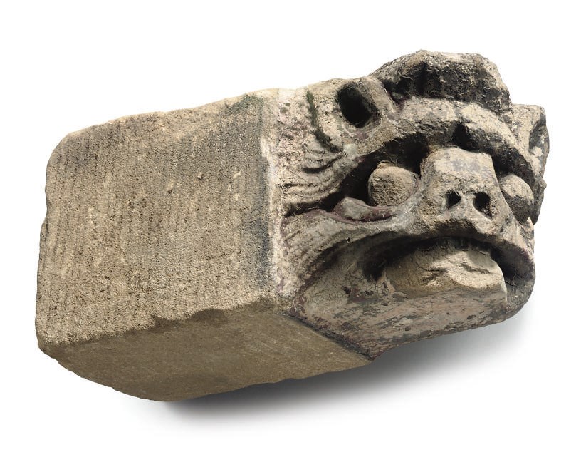 AN ENGLISH LIMESTONE CORBEL HEAD OF A LION