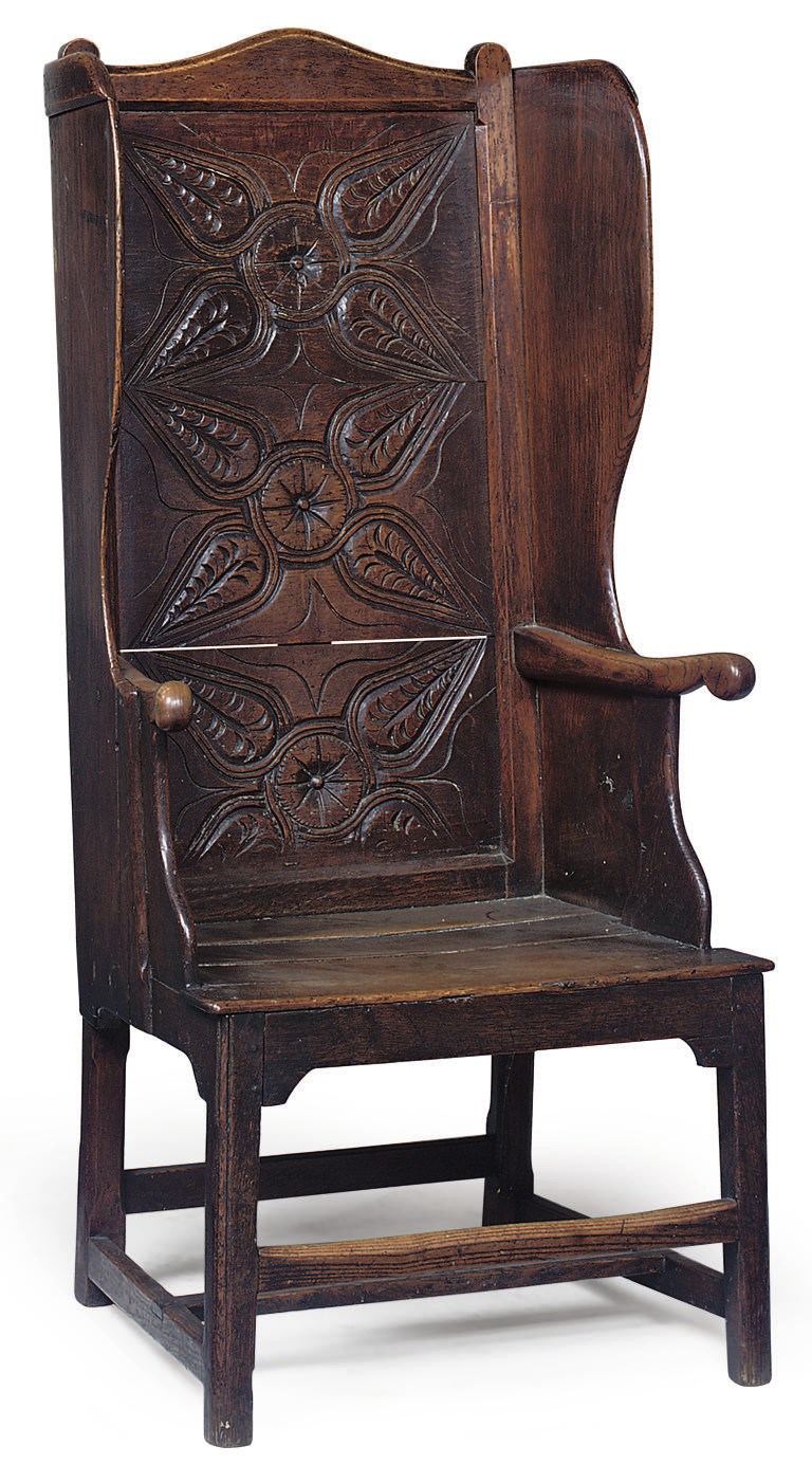 A GEORGE III OAK AND ELM WING CHAIR