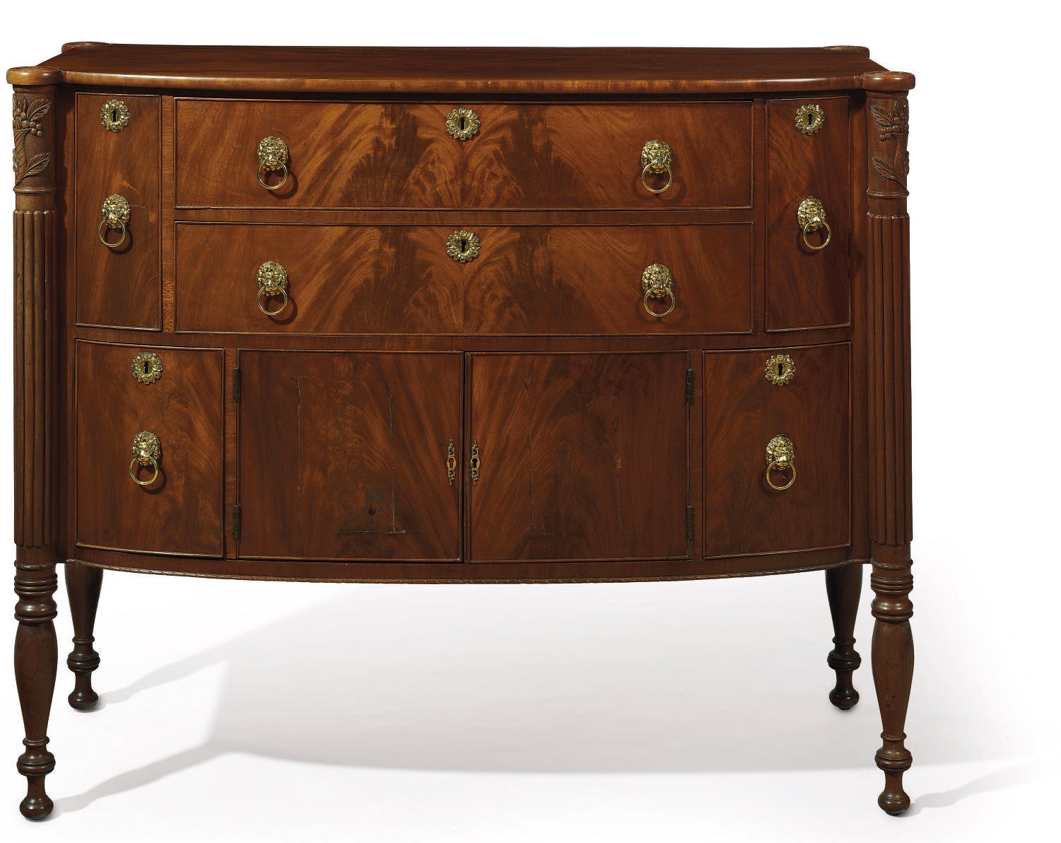 A FEDERAL FIGURED MAHOGANY BOWFRONT SIDEBOARD