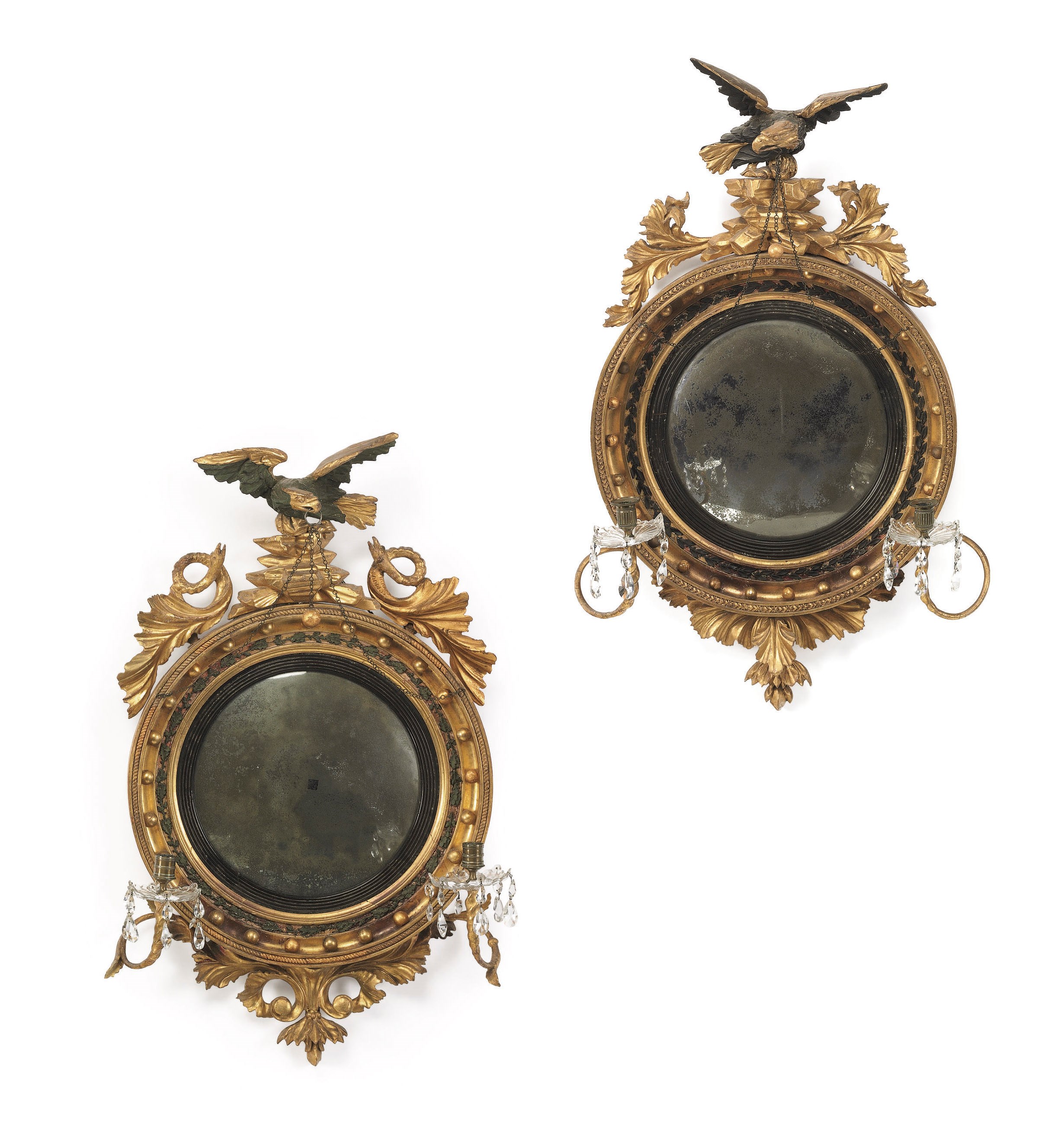 TWO SIMILAR CLASSICAL PART-EBONIZED AND GILTWOOD TWO-LIGHT GIRANDOLE LOOKING GLASSES