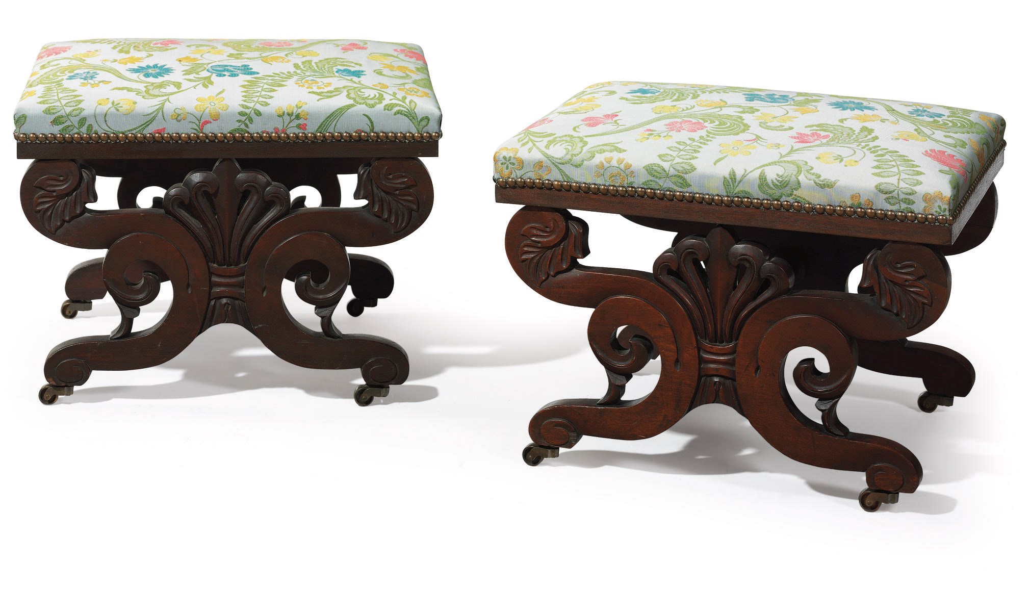 A PAIR OF CLASSICAL CARVED MAHOGANY FOOT STOOLS