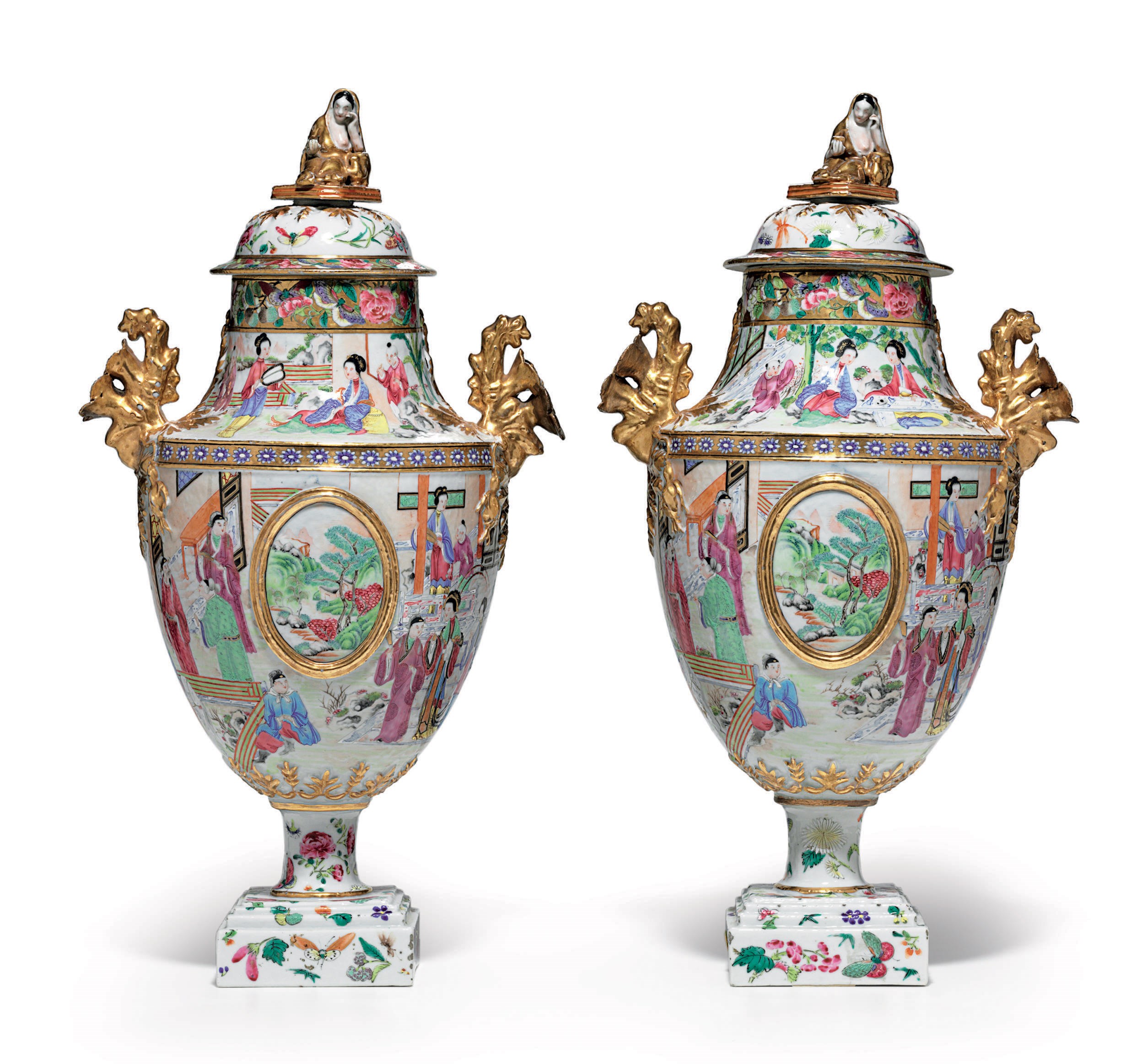 A PAIR OF "CANTON FAMILLE ROSE" URNS AND COVERS