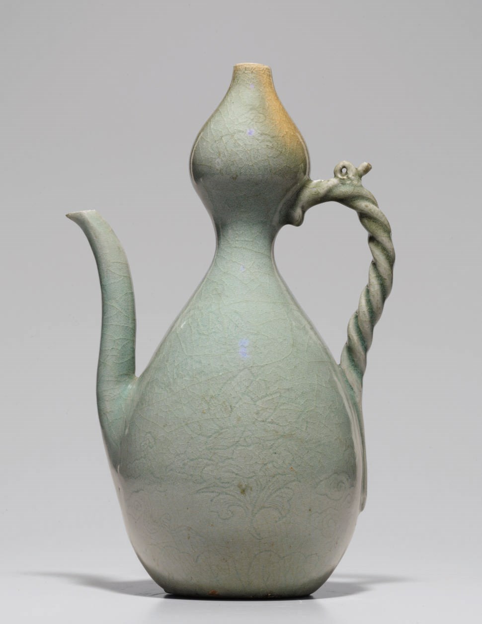 A Large Incised Celadon Stoneware Ewer