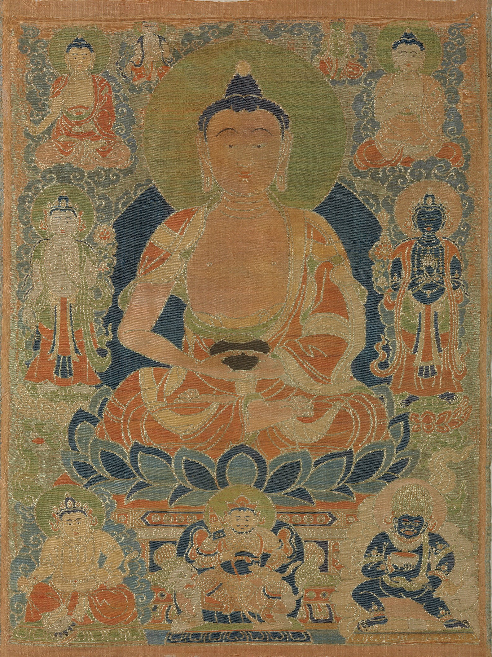A RARE SILK BROCADE THANGKA