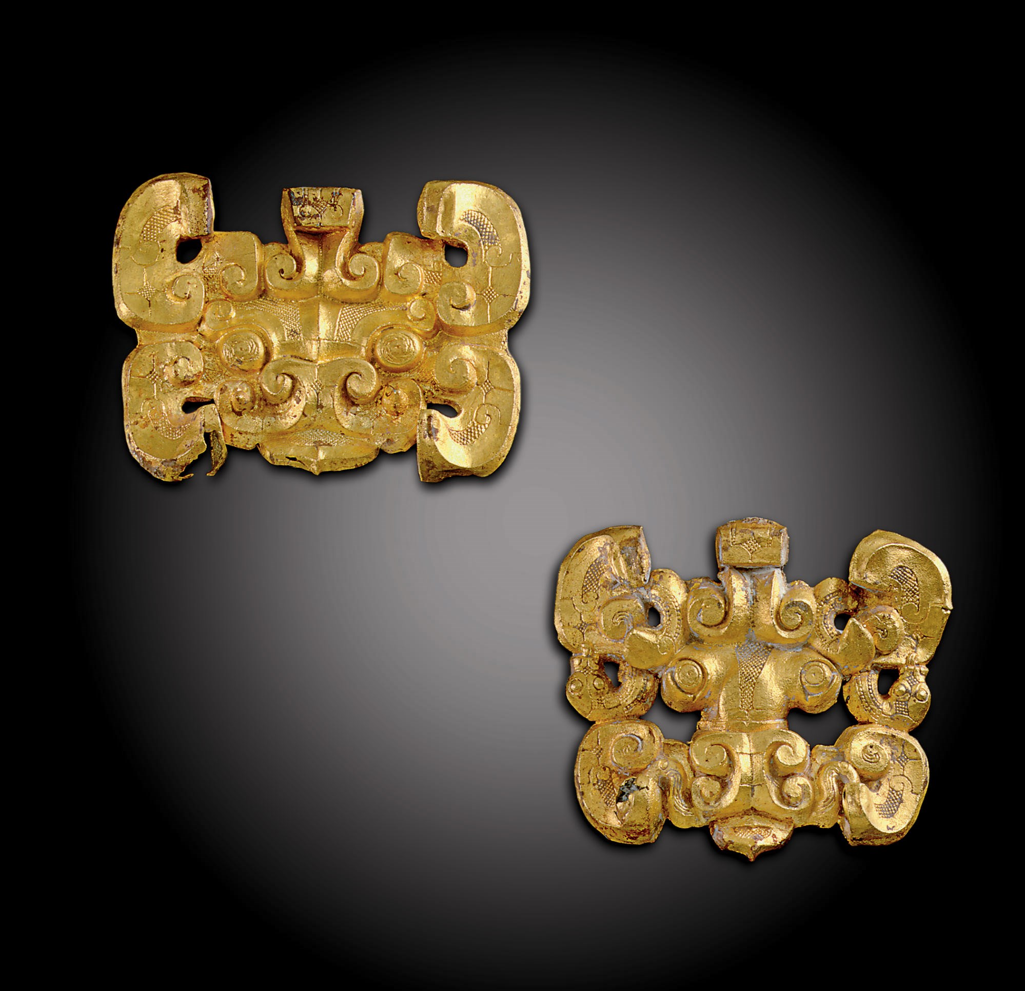 TWO RARE GOLD MONSTER-MASK FITTINGS