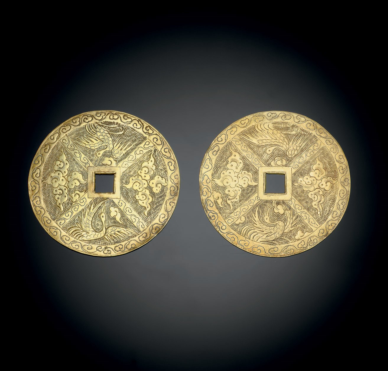 A PAIR OF GOLD FLAT 'CASH'-FORM APPLIQUES