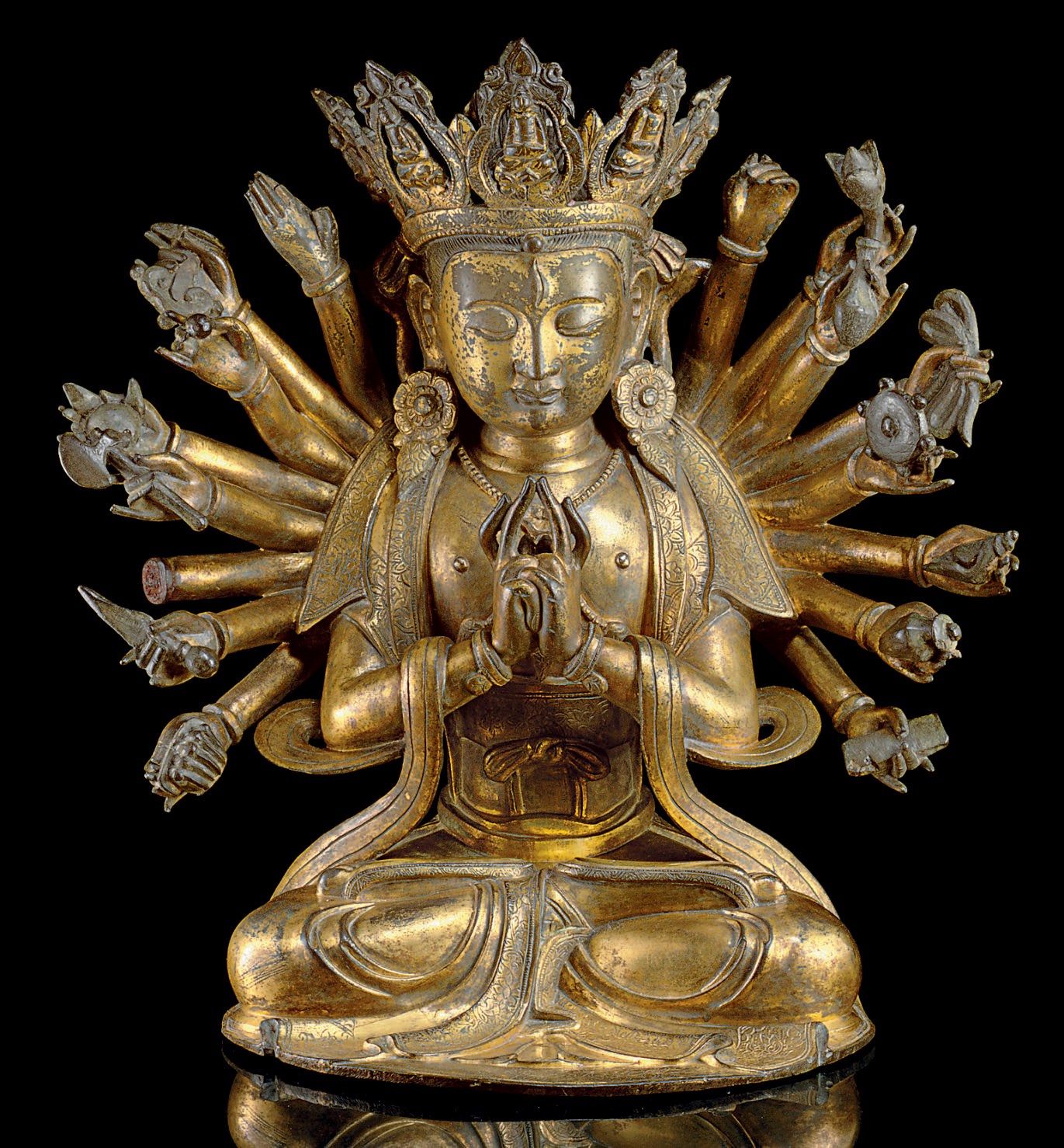 A RARE AND UNUSUAL GILT-BRONZE TANTRIC FIGURE OF AVALOKITESVARA
