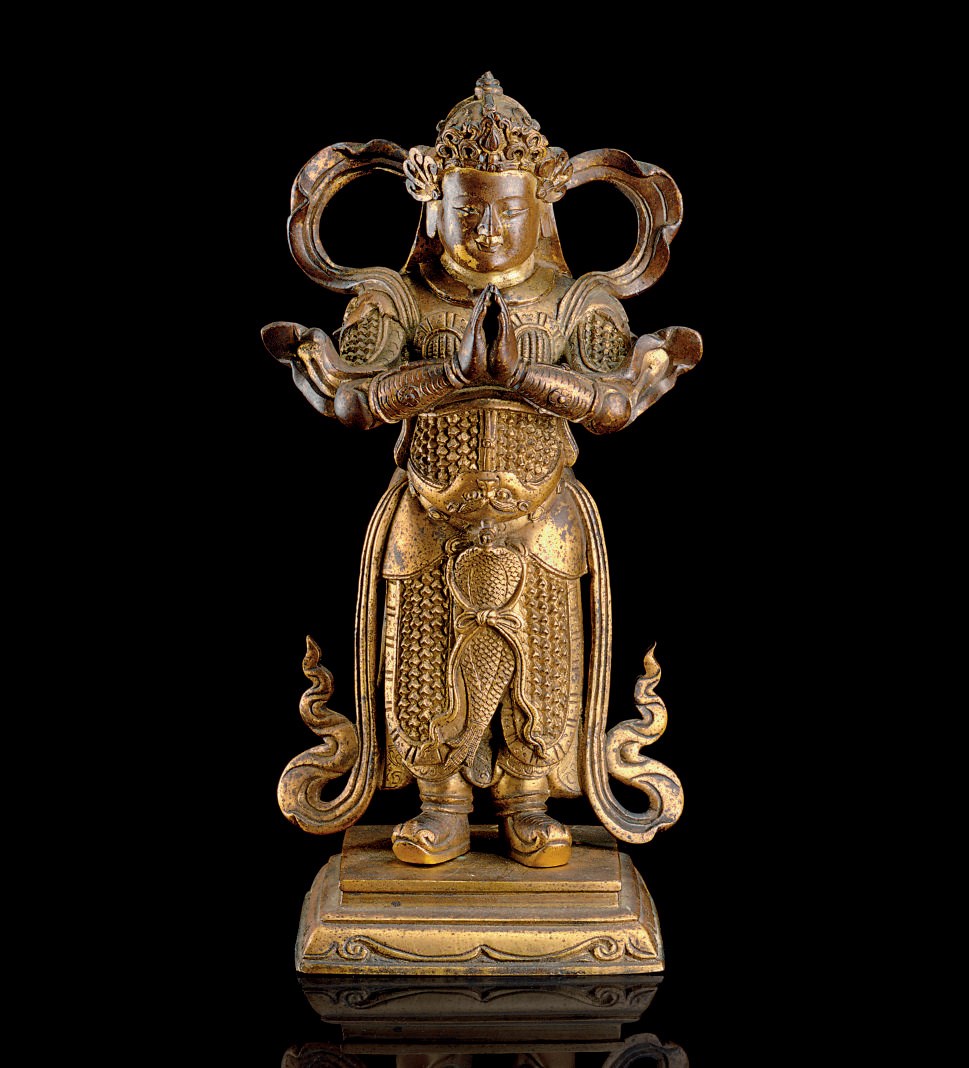 A FINELY CAST GILT-BRONZE FIGURE OF A GUARDIAN KING
