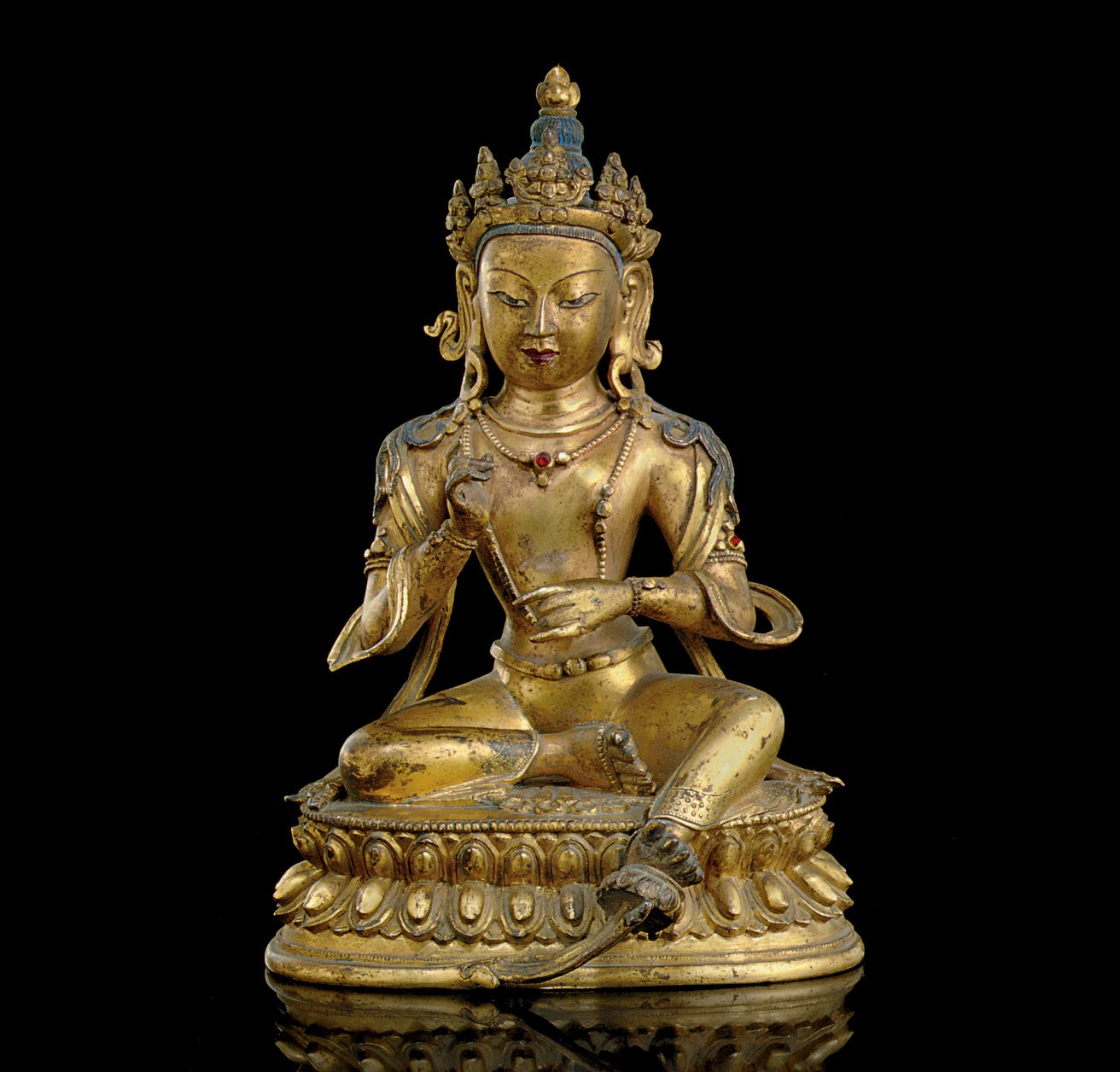 A GILT-BRONZE FIGURE OF A SEATED BODHISATTVA