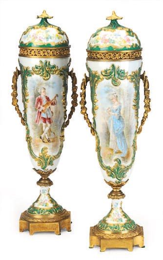 A PAIR OF GILT METAL-MOUNTED SEVRES STYLE GREEN GROUND VASES AND COVERS,
