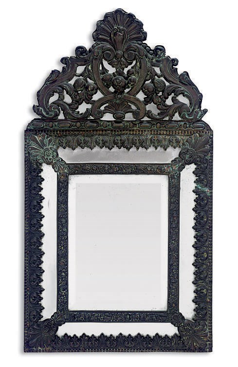 A NEAR PAIR OF FLEMISH REPOUSEE BRASS FRAMED MARGINAL MIRRORS