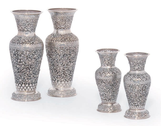 A SUITE OF FOUR CHINESE SILVER VASES