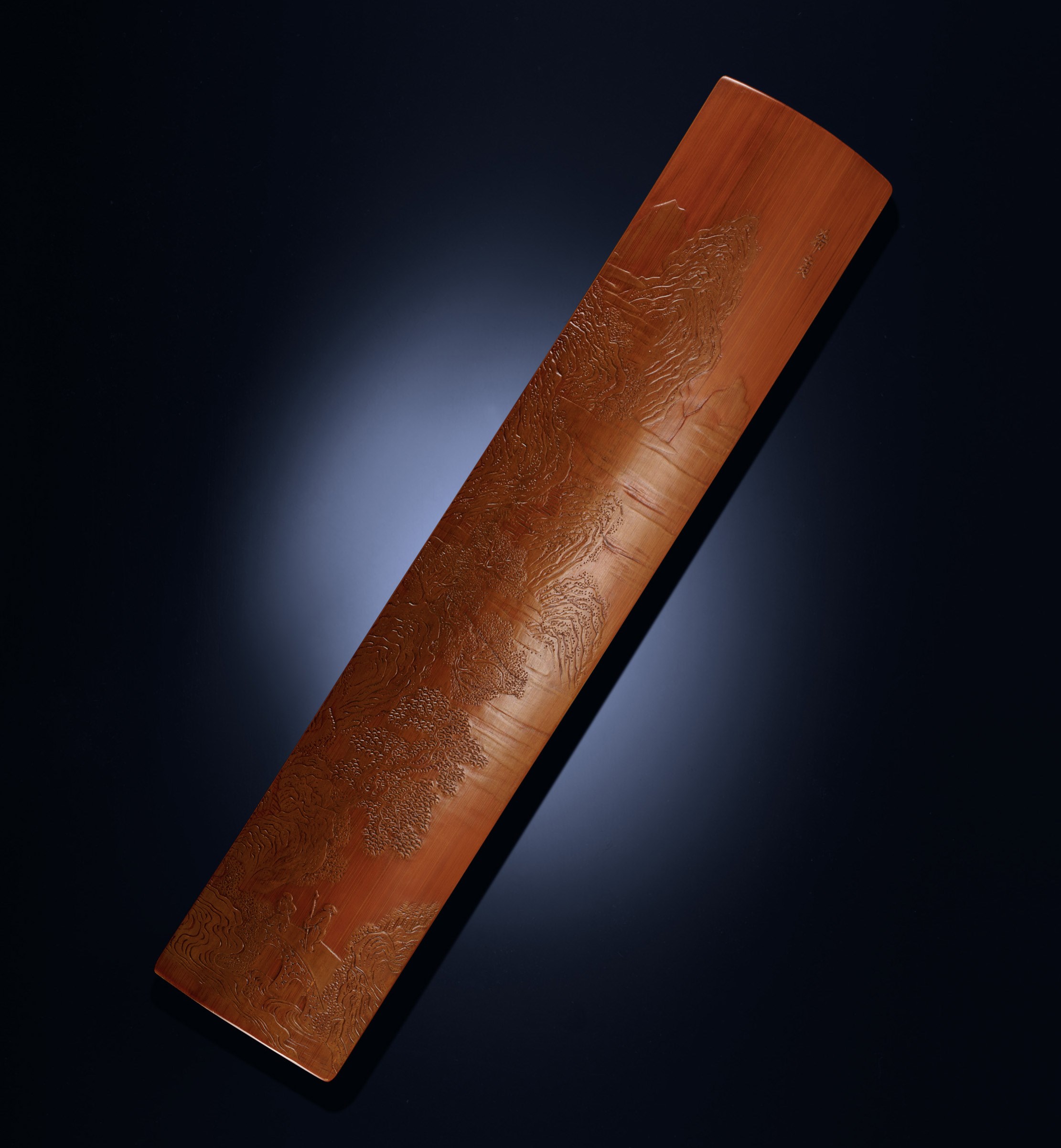 A CARVED BAMBOO WRISTREST