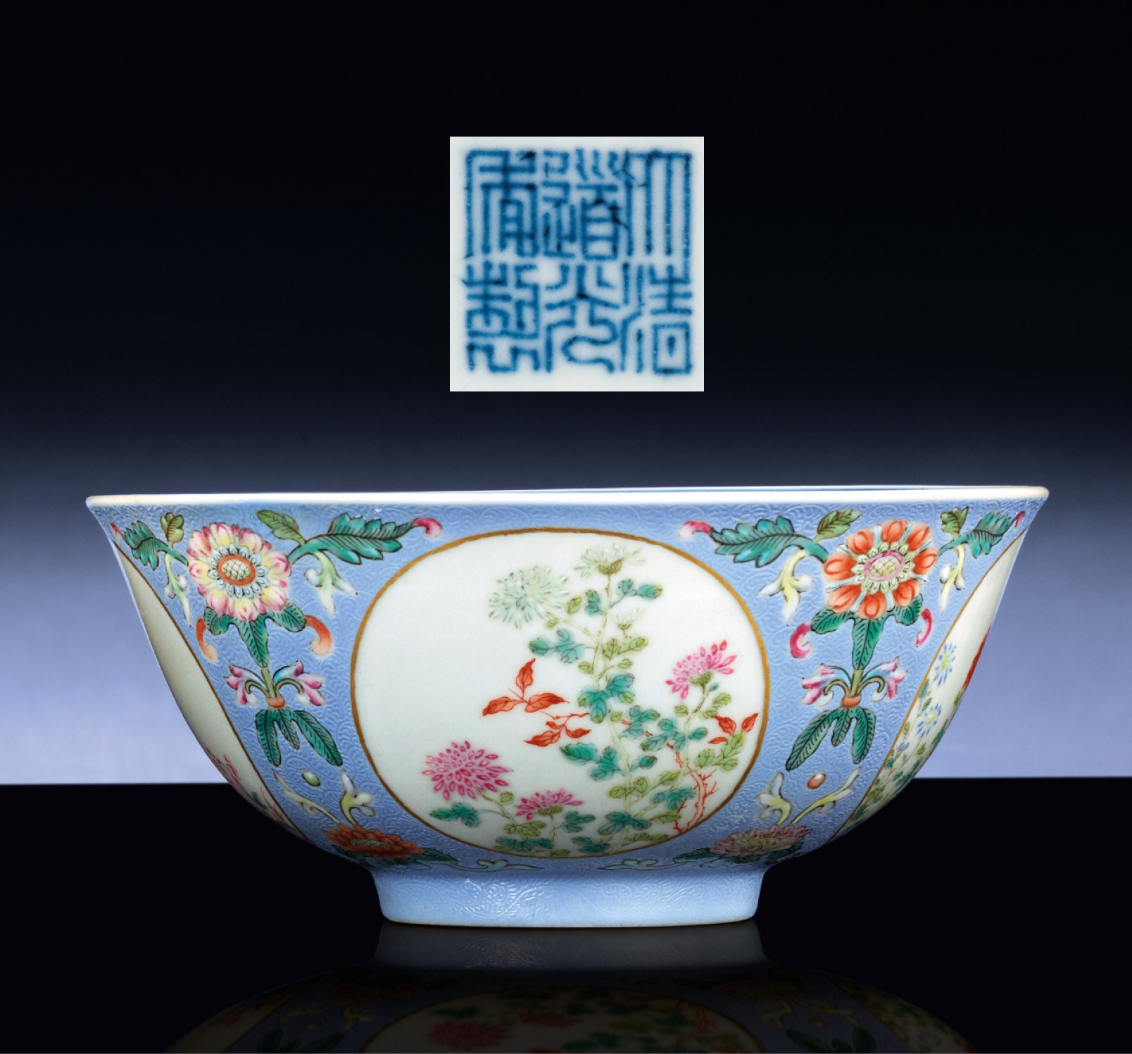 A BLUE-GROUND FAMILLE ROSE 'MEDALLION' BOWL