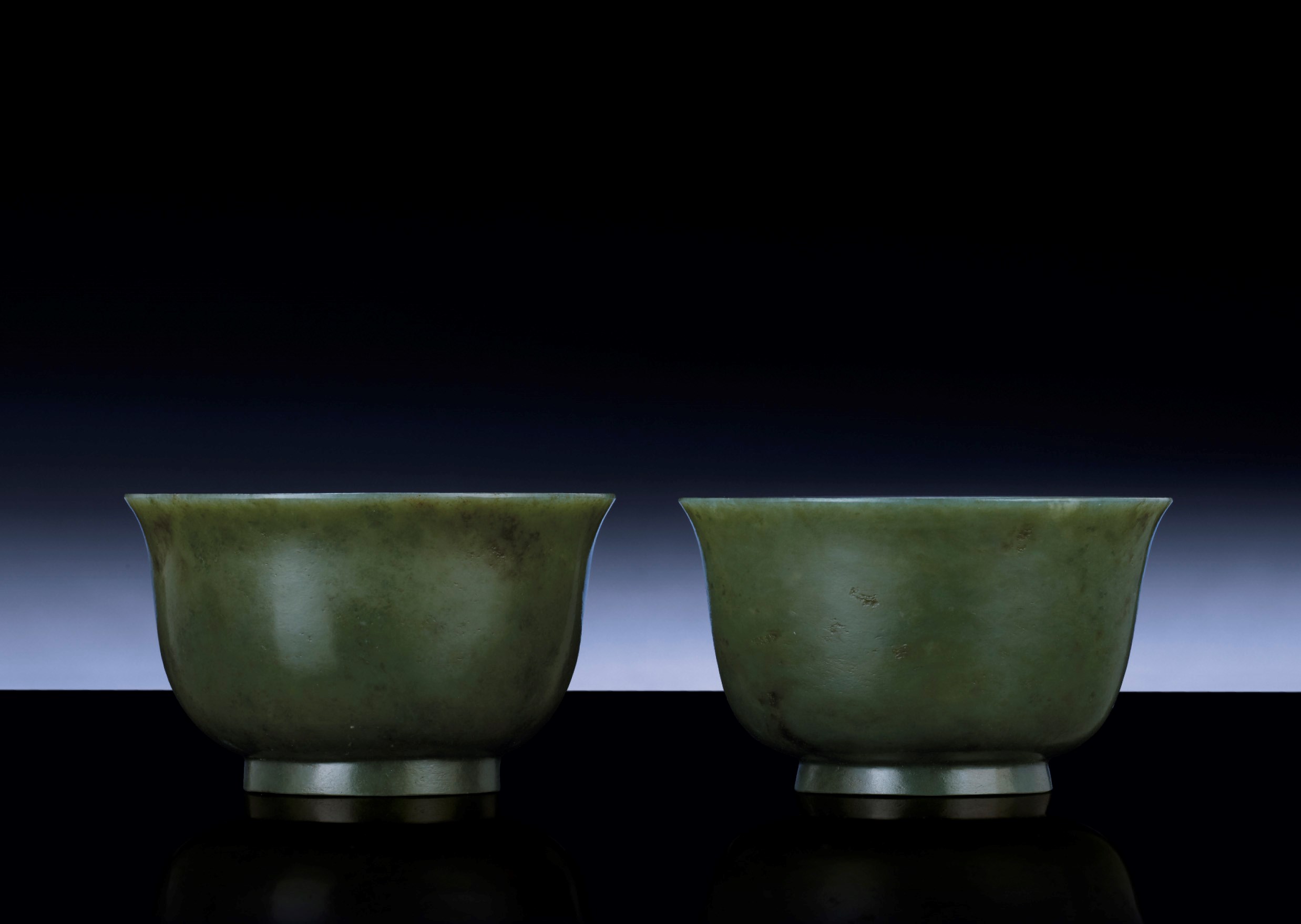A PAIR OF SPINACH-GREEN JADE BOWLS