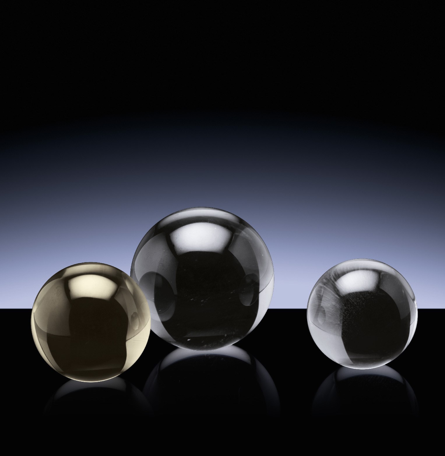 THREE GRADUATED ROCK CRYSTAL SPHERES