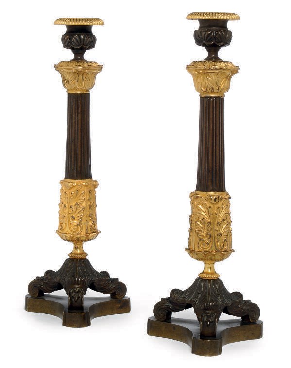 A PAIR OF GILT AND PATINATED BRONZE RESTAURATION CANDLESTICKS