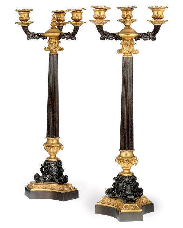 A PAIR OF FRENCH GILT AND PATINATED BRONZE THREE-LIGHT CANDLEABRA
