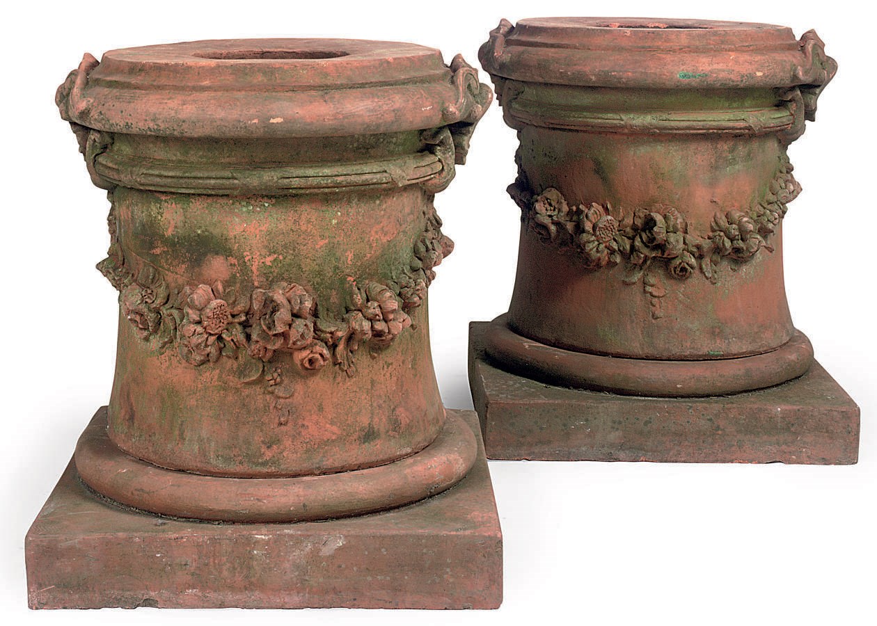 A LARGE PAIR OF TERRACOTTA PLINTHS