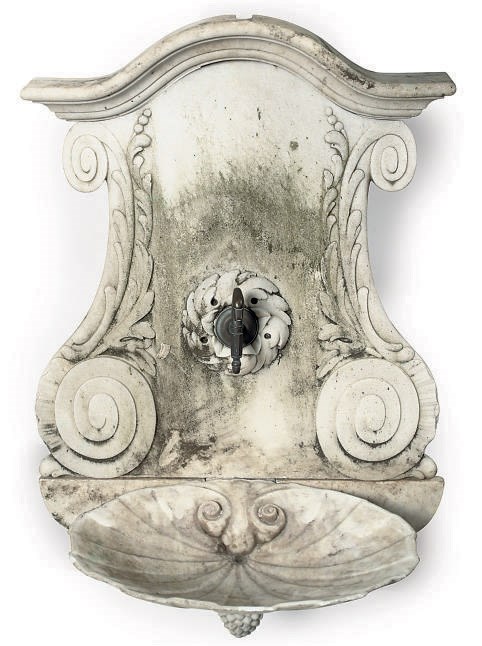 A CARVED MARBLE WALL FOUNTAIN