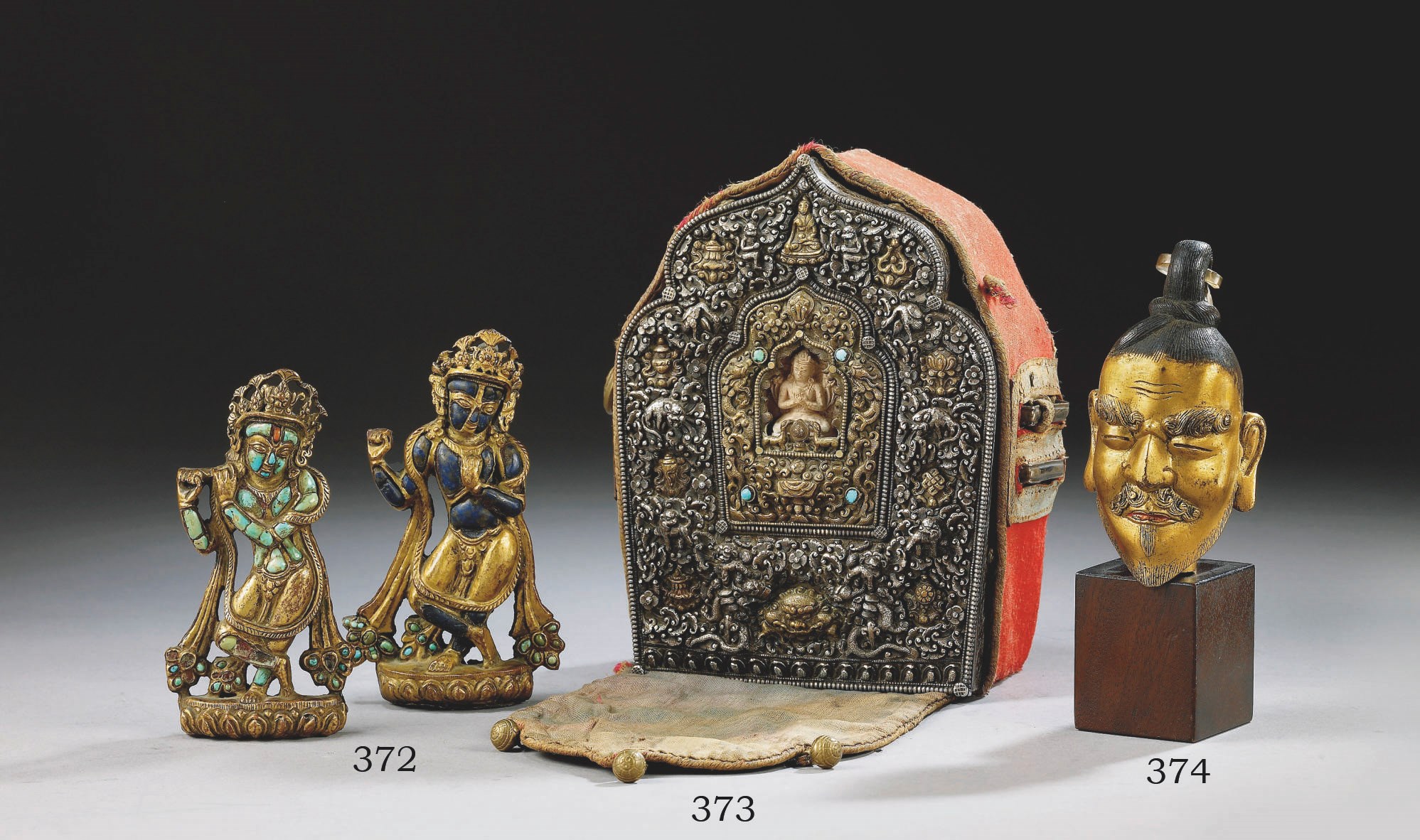 DEUX ORNEMENTS EN CUIVRE DORE, REPOUSSE ET INCRUSTE