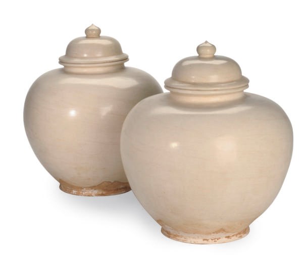 A PAIR OF LARGE TANG-STYLE WHITE-GLAZE POTTERY JARS AND COVERS,