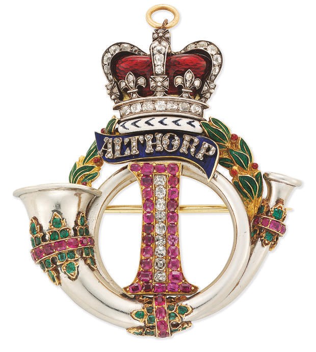 A DIAMOND AND GEM-SET BROOCH