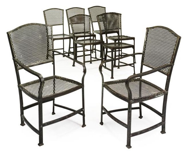 A NEAR SET OF EIGHT PIERCED METAL GARDEN CHAIRS