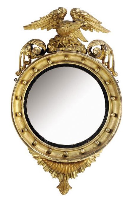 AN EARLY VICTORIAN CARVED GILTWOOD AND GESSO CONVEX MIRROR