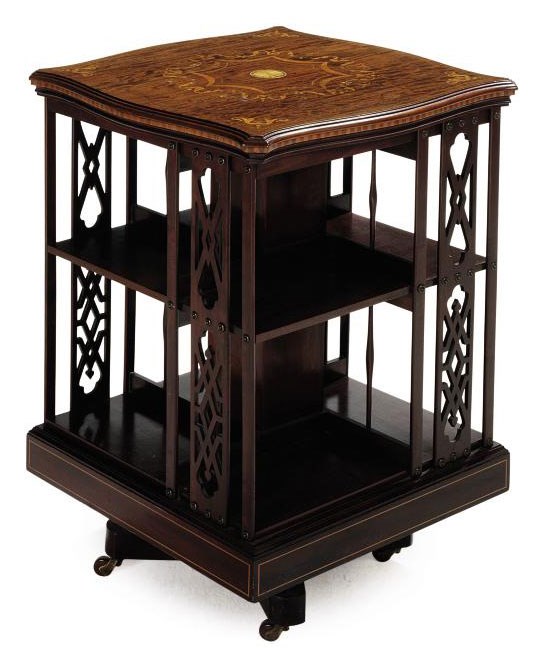 AN EDWARDIAN MAHOGANY AND MARQUETRY INLAID REVOLVING BOOKCASE