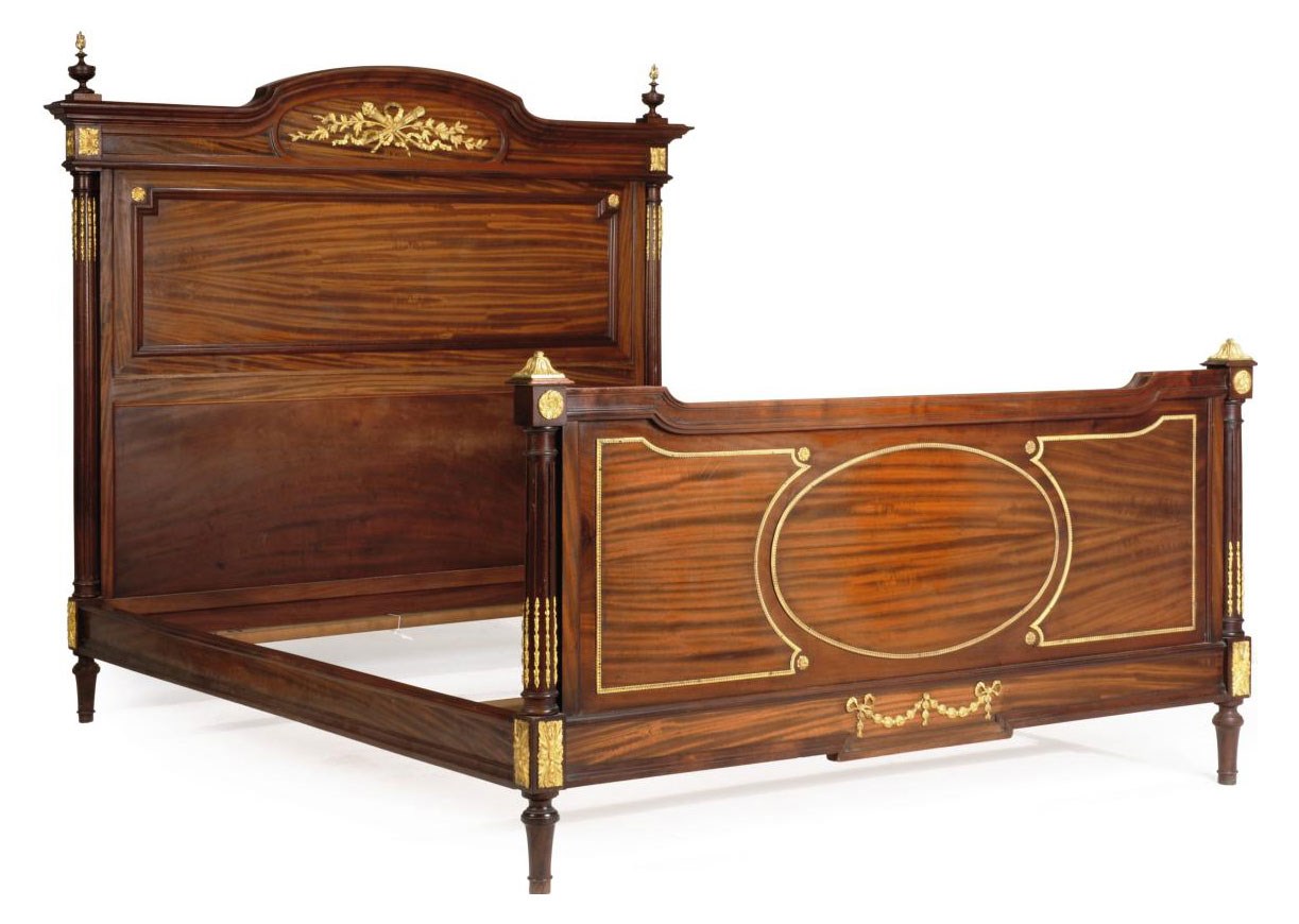 A FRENCH MAHOGANY AND GILT-METAL MOUNTED BED