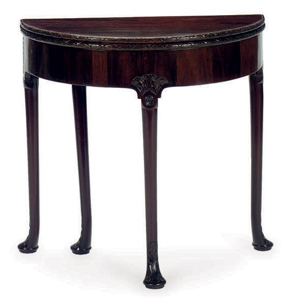 AN ENGLISH CARVED MAHOGANY FOLD-OVER CARDS TABLE,