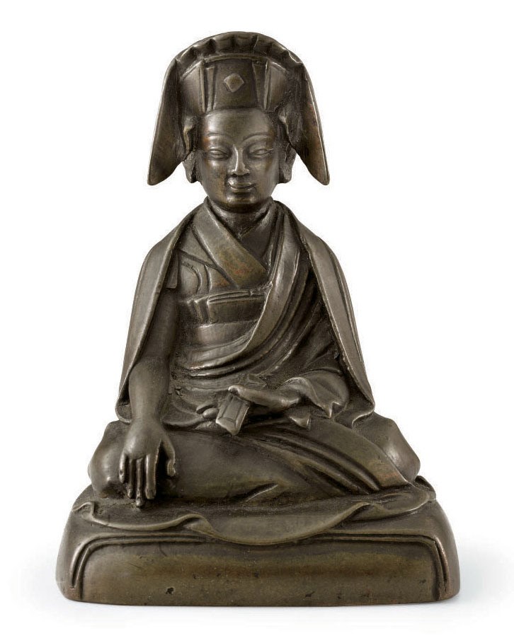 A bronze figure of a Lama