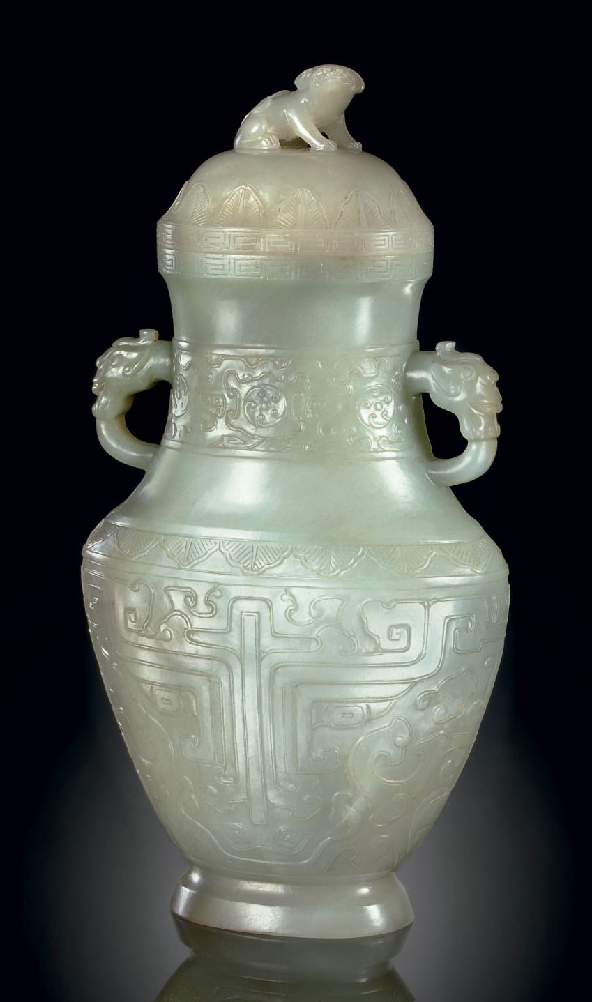 A PALE GREYISH-GREEN JADE ARCHAISTIC VASE AND A COVER