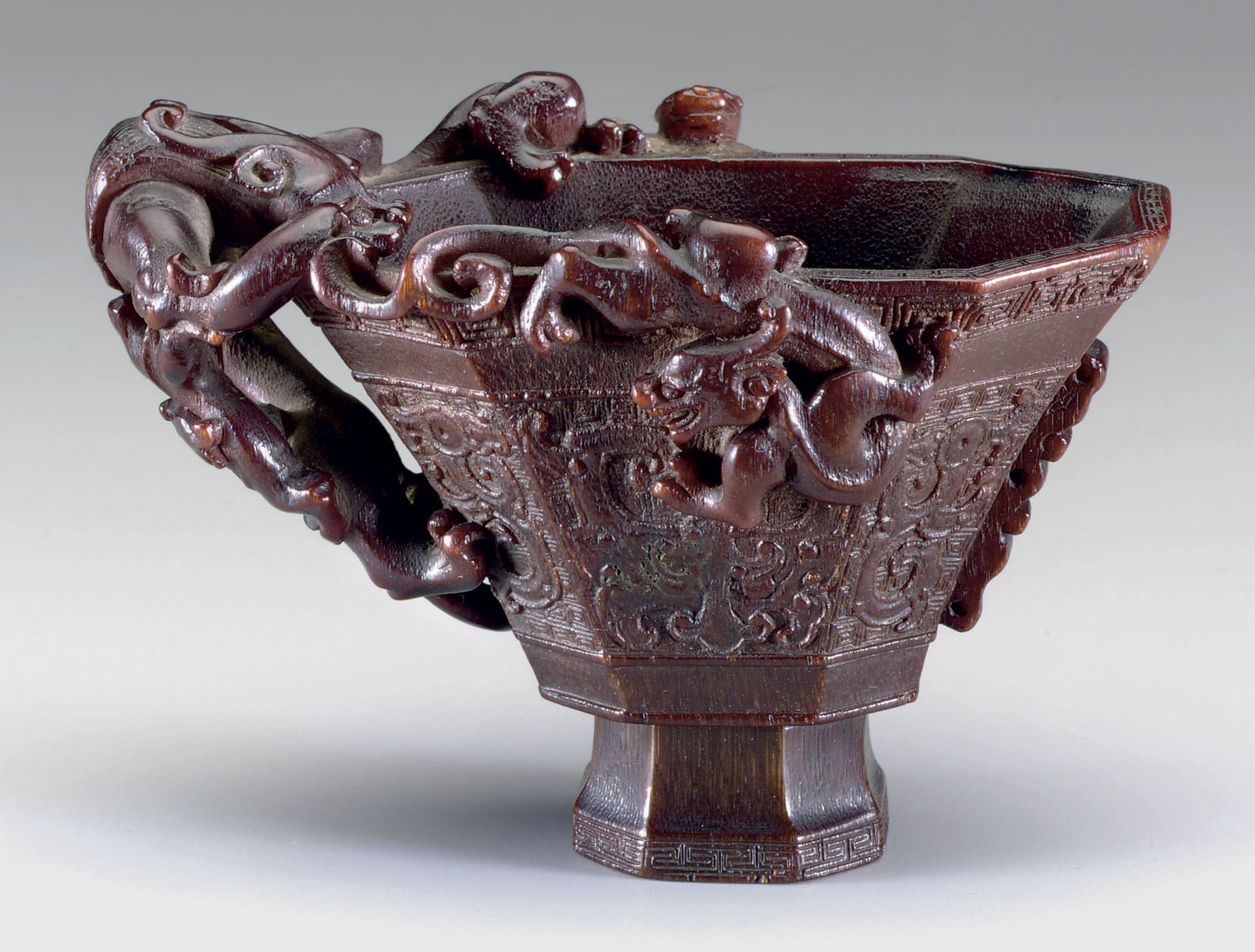 A SMALL ARCHAISTIC RHINOCEROS HORN CUP