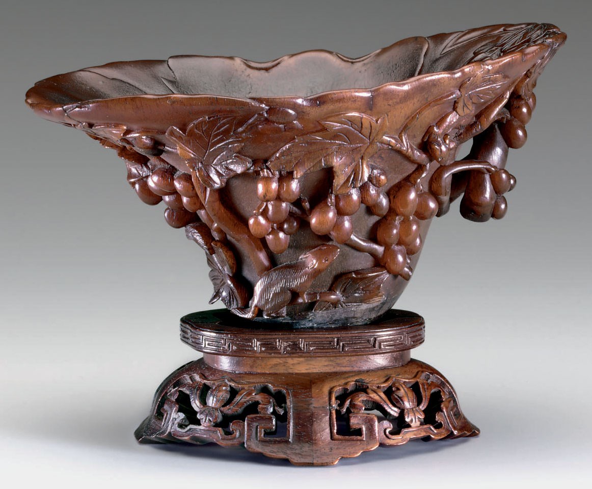 A RHINOCEROS HORN LIBATION CUP