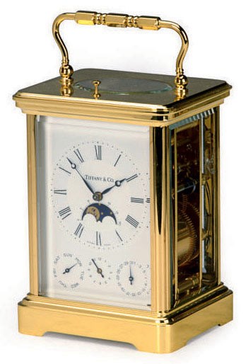 A SWISS BRASS AND ENAMEL CARRIAGE CLOCK,