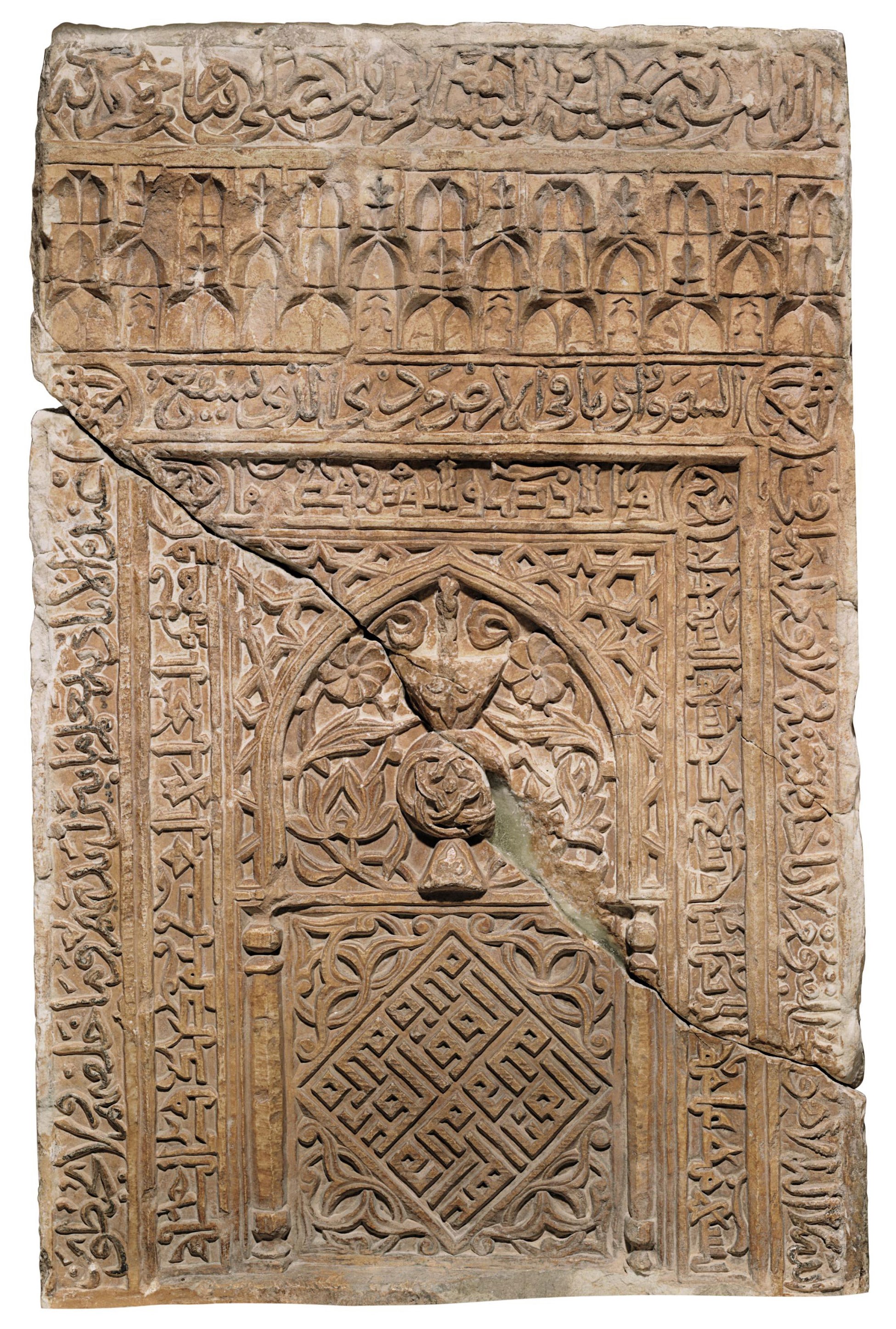 A CARVED STONE MIHRAB PANEL