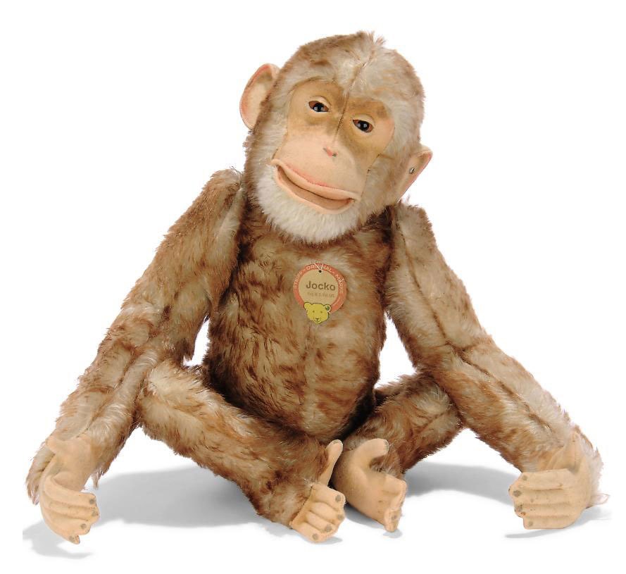 A STEIFF JOINTED BROWN-TIPPED MOHAIR JOCKO, (5325), brown and black glass eyes, felt face, ears, hands and feet, open mouth, white mohair chin, swivel head, inoperative squeaker, FF button with remains of white paper tag and chest tag, 1920s --13½in. (34cm.) high (very slight staining to felt)