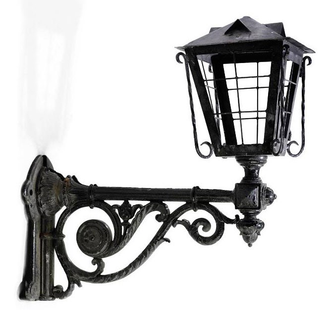 A VICTORIAN SHEET-IRON LANTERN ON AN IRON BRACKET